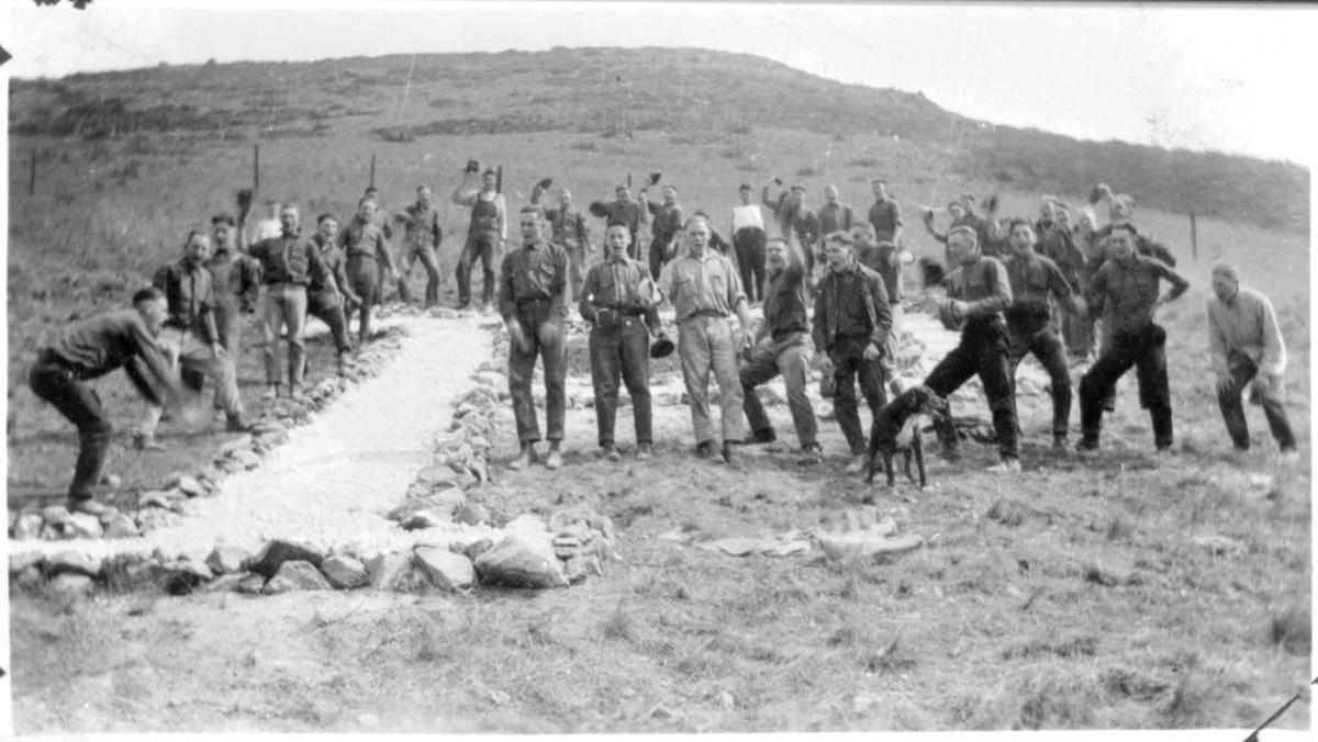 People gather on the hillside around the Cal Poly P in 1921.