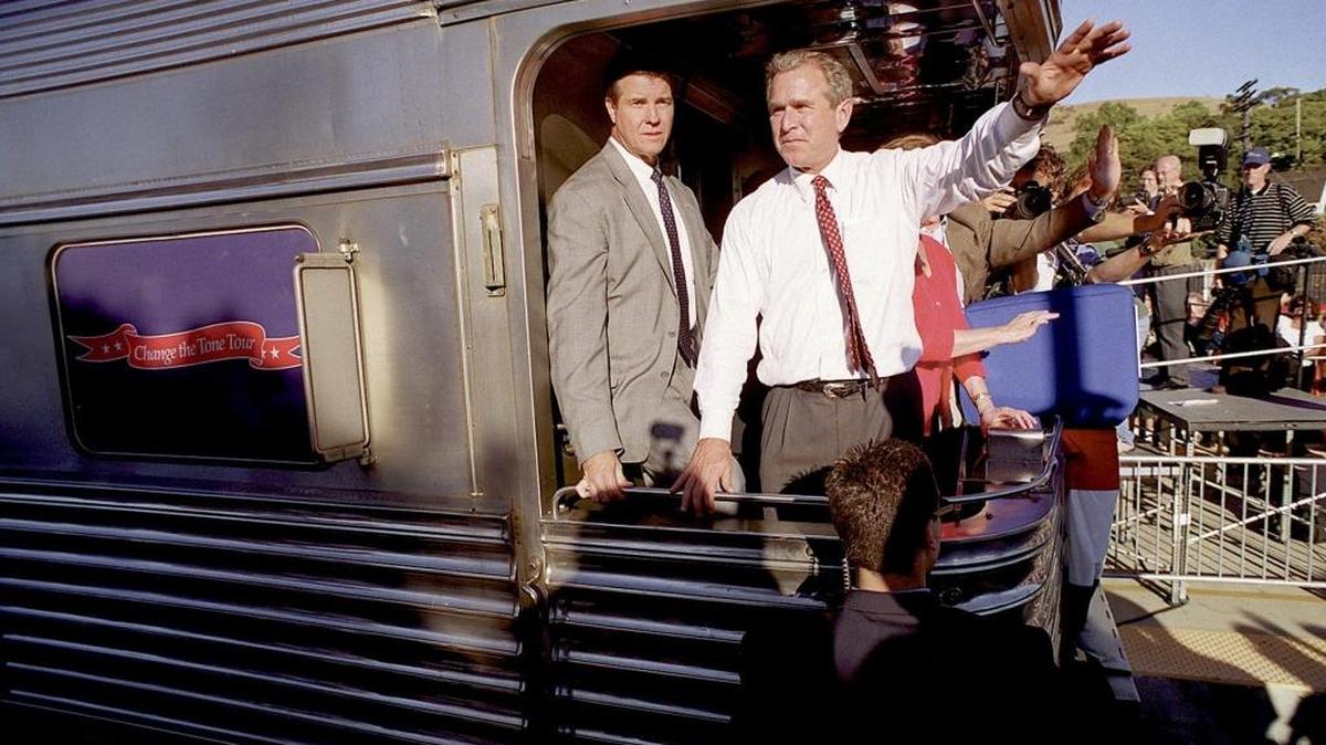 Presidential candidate George W. Bush waves to the crowd as his train pulls into the San Luis Obispo train station in 2000.
