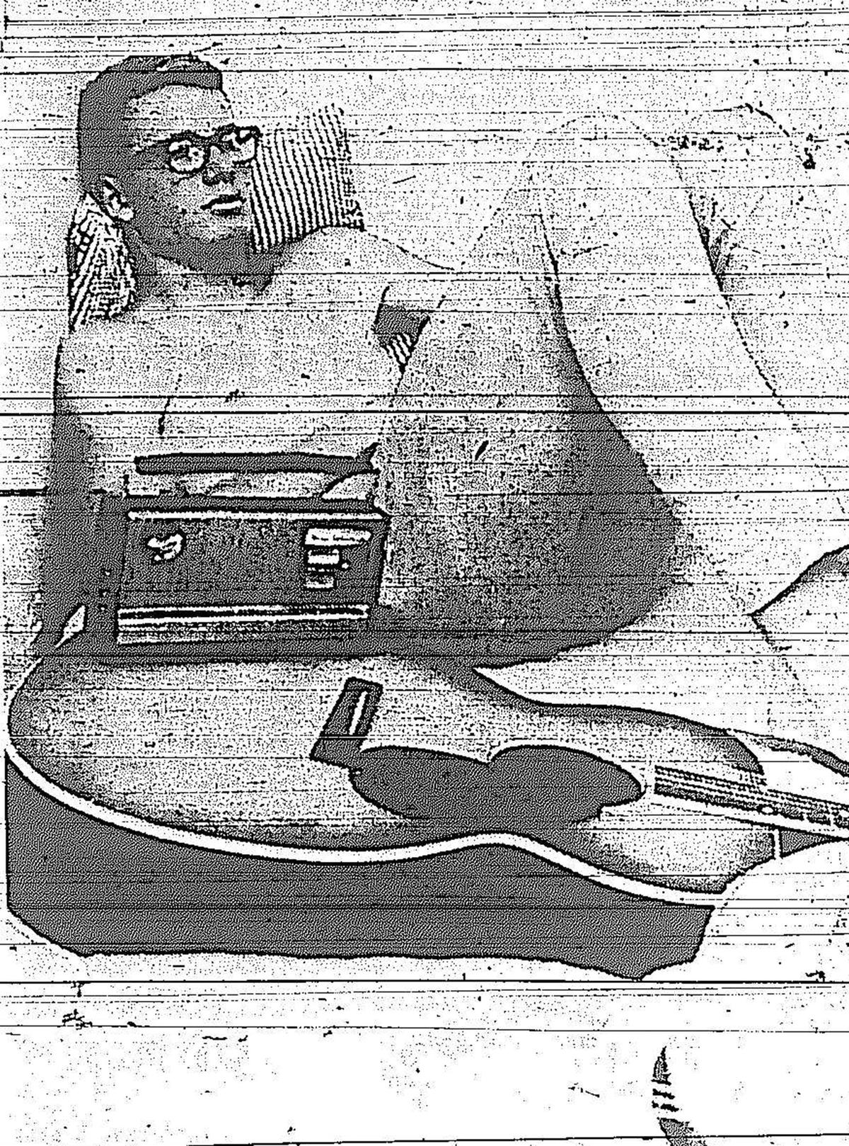 Terry Philbin relaxes in a labor camp barrack as the A-TEAM of high school laborers wait for the tomato harvest in Merced in 1965.