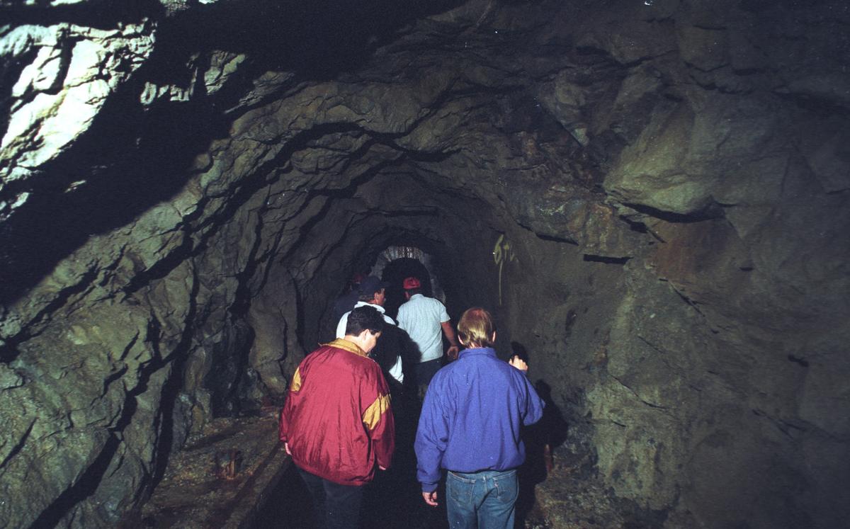 Parts of the Cuesta Tunnel are lined with concrete, while others are rough hewn.  The tunnel, seen in 1994, was built in 1941 to supply water to Camp San Luis Obispo, which was being expanded in the early days of World War II.