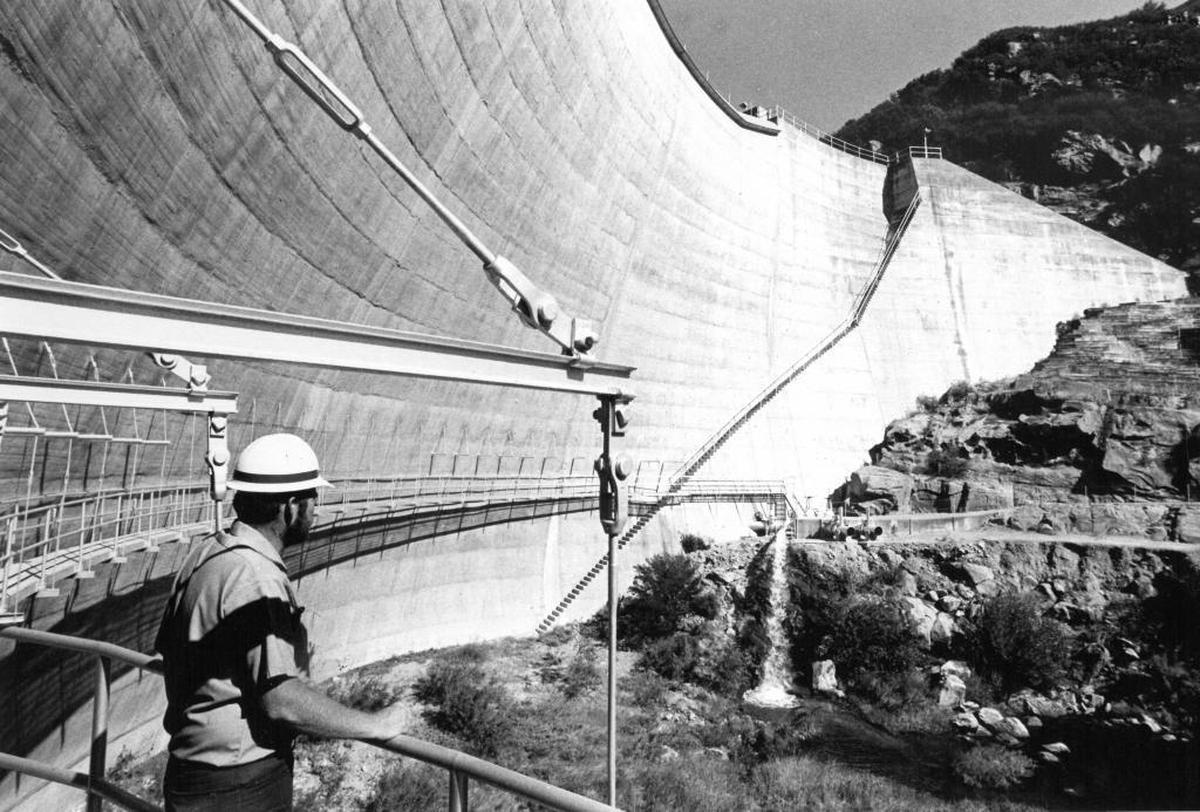 County water worker Kenneth “Rick” Meeks surveys the downstream side of the 135-foot-tall Salinas Dam.