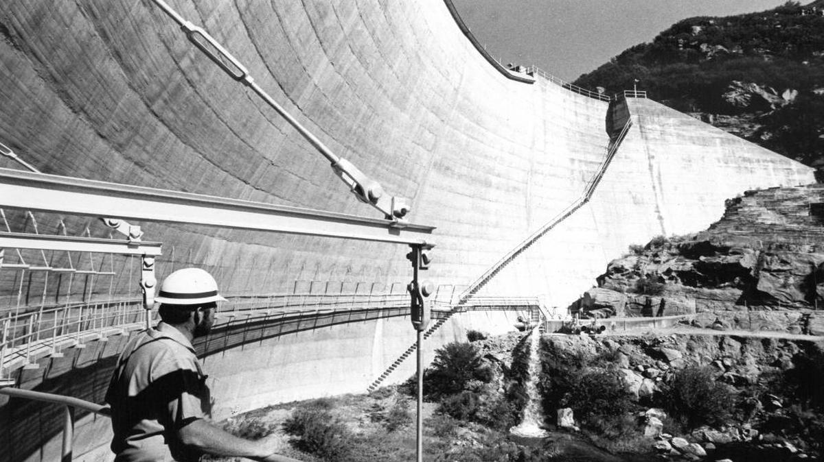 County water worker Kenneth “Rick” Meeks surveys the downstream side of the 135-foot-tall Salinas Dam.