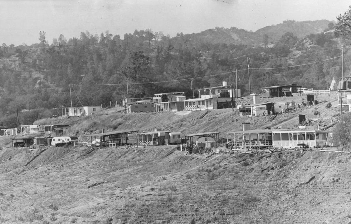 Nacimiento Lake "campsites" in November 1969 featured outdoor toilets and travel trailers under makeshift sheds.