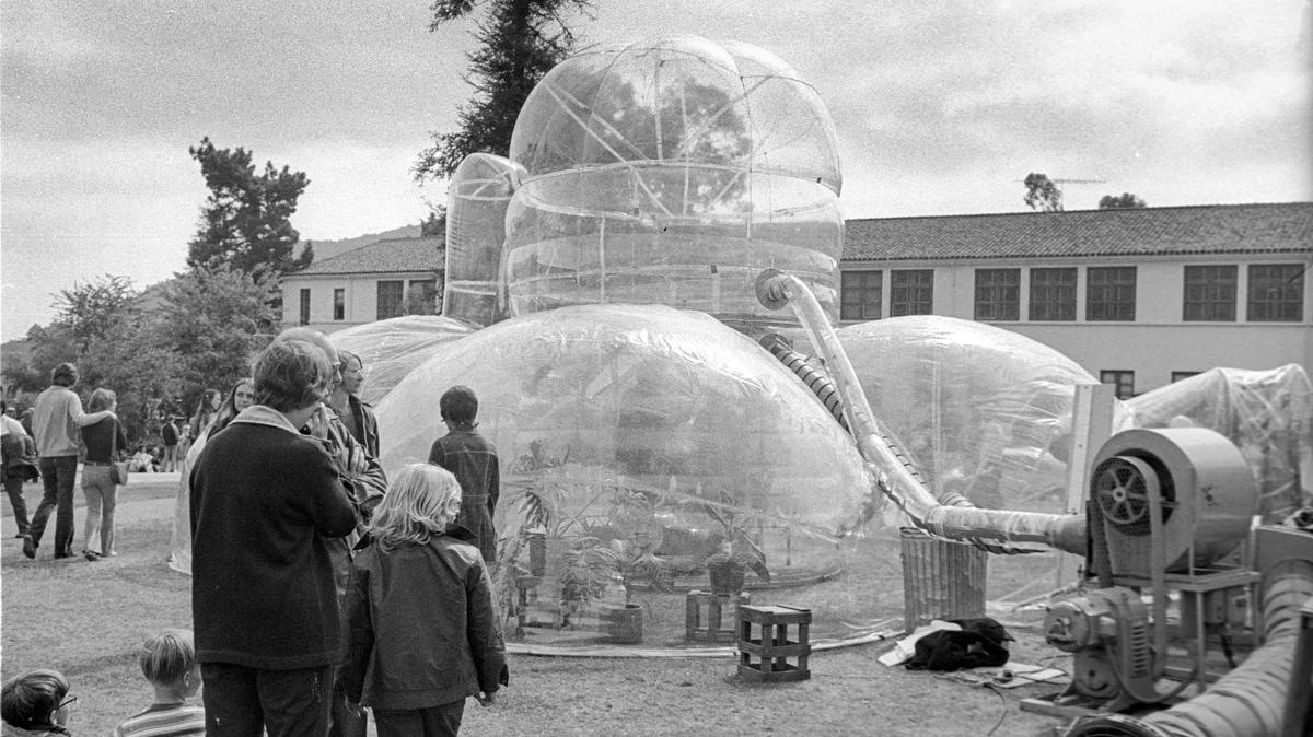 Cal Poly students built an experimental plastic bubble house with two levels in 1973 and displayed it at Poly Royal. Three students planned to live in it the following school year.