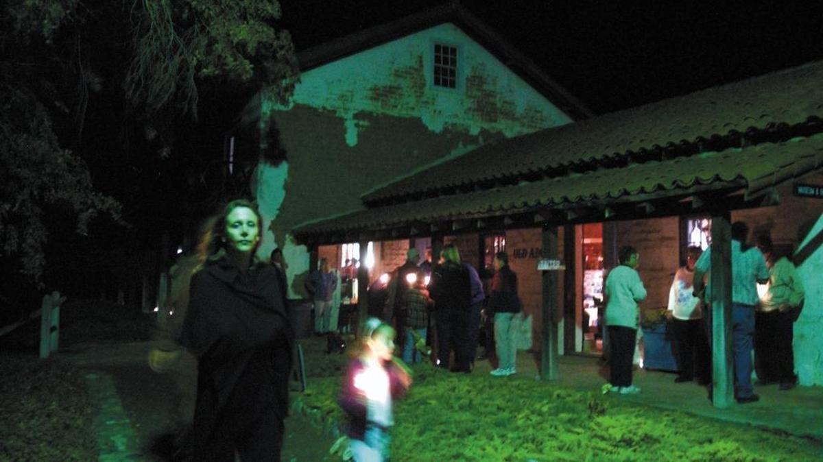 Vickie Carroll of Templeton and her daughter Madeleine, 6, turned out for a candlelight tour of the Rios-Caledonia Adobe in San Miguel in 2005. A former curator reportedly heard sounds of a stampede at the spot.