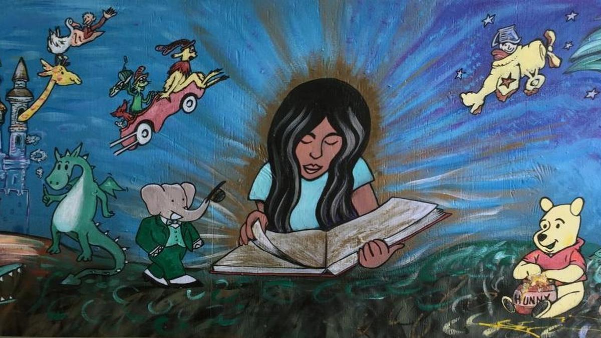 Steven Smith’s mural based on themes from children’s literature at the home of Liz and Dan Krieger.