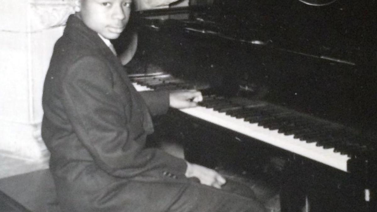 Joe Lewis playing the piano at age 14.