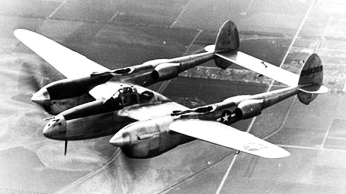 A Lockheed P-38 Lightning plane flies over the Santa Maria Valley in 1943