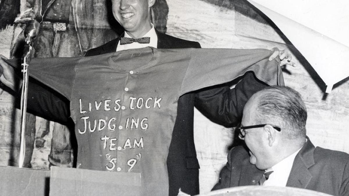 Richard Johnson, in 1953, holds up a jersey with the “5.9” composite score that reflects Cal Poly being the first to win the “West Coast Triple Crown (Portland, San Francisco and Ogden)” for intercollegiate livestock judging. Next to him is Julian McPhee, who was a longtime Cal Poly president.