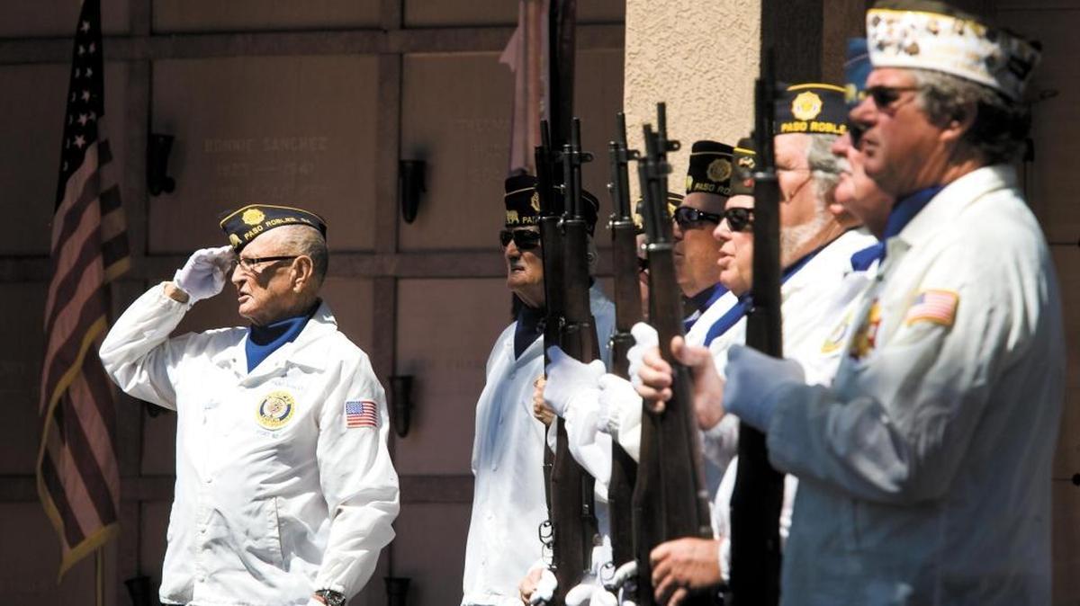 Gordon Mutter, left, leads the American Legion and VFW honor guard in a salute to the flag at Memorial Day observation at Paso Robles District Cemetery in 2014. Several Memorial Day events are planned in San Luis Obispo County for Monday, May 28, 2018.