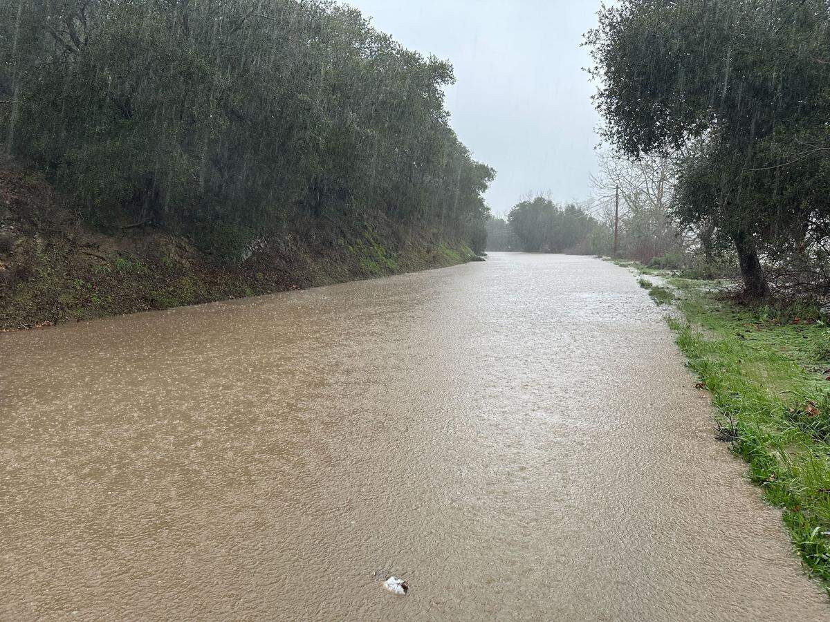 The storm turned Avila Beach Road in San Luis Obispo County from a road to a river on Jan. 9 2023. A motorist died after ignoring road signs.