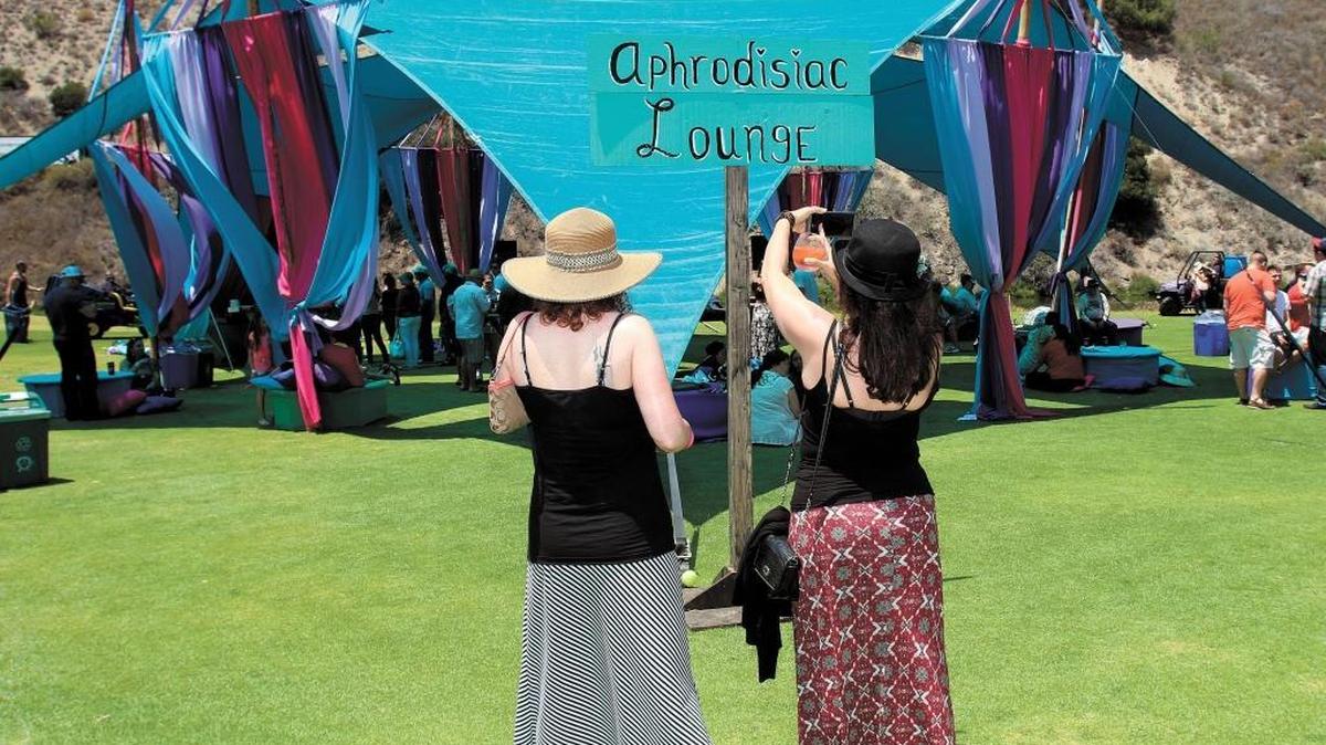 Festival goers take a photo of the Aphrodisiac Lounge at the fourth annual Central Coast Oyster & Music Festival at the Avila Beach Golf Resort in June 2015.