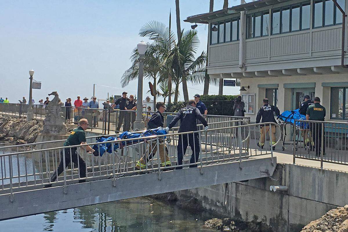 Bodies are brought ashore at the Santa Barbara Harbor after the Conception dive boat caught fire and sank near Santa Cruz Island. Four bodies have been recovered, and at least 29 people are missing or feared dead.