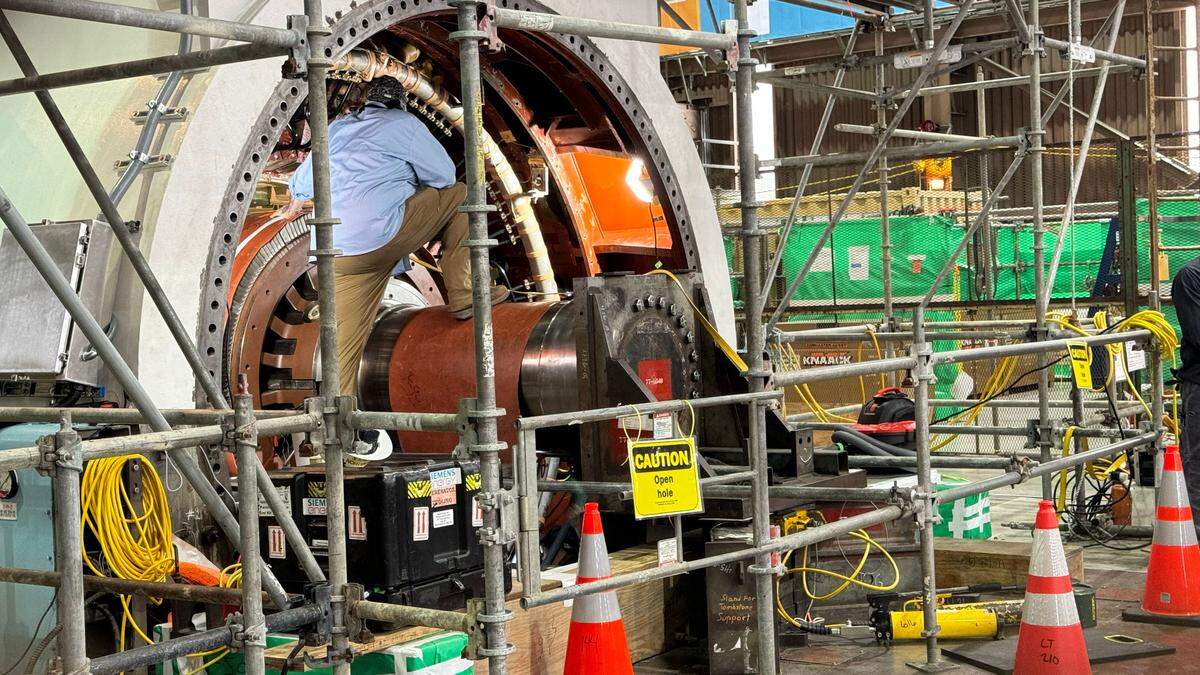 A technician works inside the Unit 2 turbine during a refueling outage at Diablo Canyon nuclear power plant in April 2024.