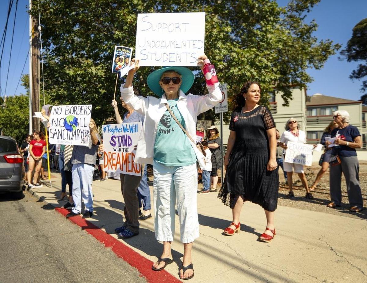 Supporters of DACA gather outside the office of Congressman Salud Carbajal in San Luis Obispo on Tuesday for a rally in support of the program.