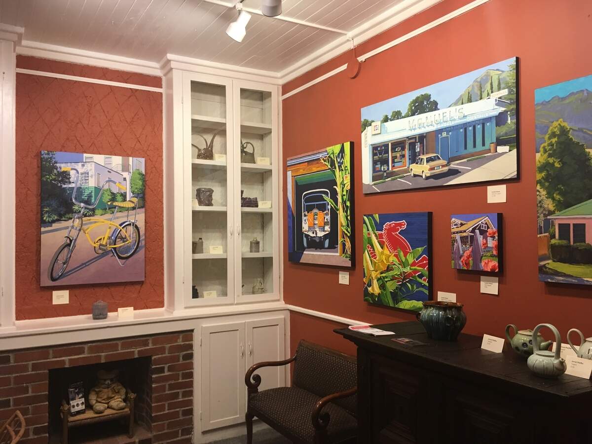 This photo depicts art for sale in the Secret SLO office.