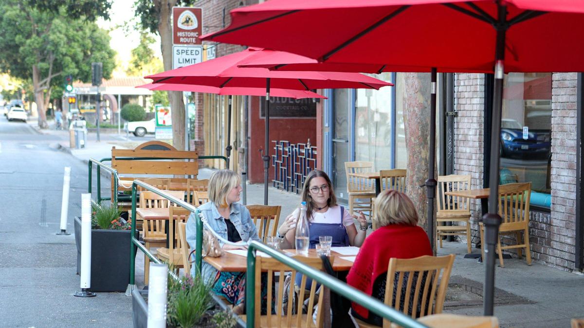 San Luis Obispo is using parklets to encourage people to eat outside and space out to prevent the spread of COVID-19. Here, Courtney Colerick, Lucy Schwartzman and Shohreh Niku have dinner at Big Sky Cafe on Broad Street.