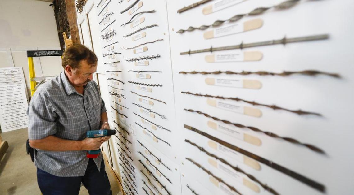 Mark Nelson, president California Barbed Wire Collectors Association, puts up a new display board. The Pioneer Museum in Paso Robles is opening a new display of the largest collection of barbed wire west of the Rocky Mountains.