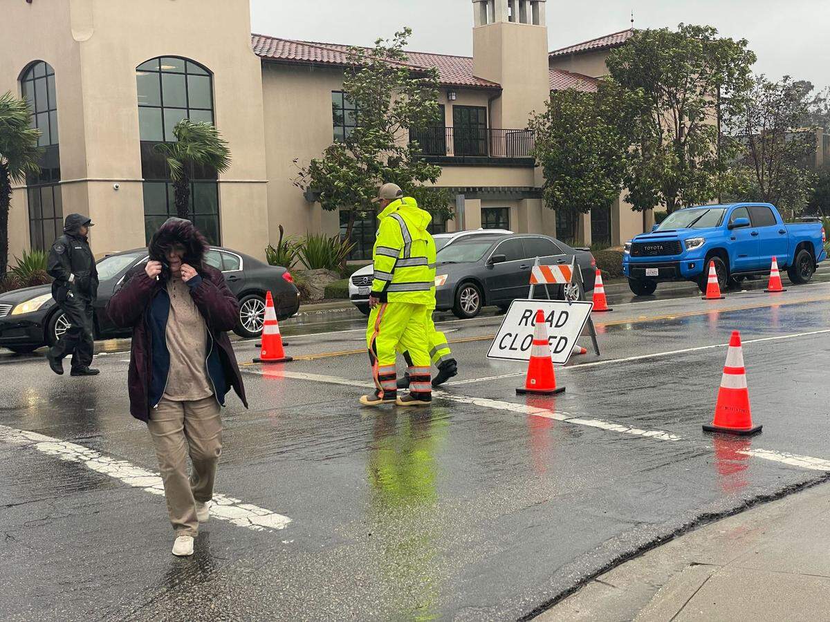 Emergency workers route traffic on South Higuera Street and Prado Road on Jan. 9 2023.