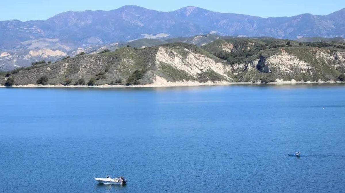 Boats float around Lake Cachuma. Santa Barbara County is exploring how to change the rule that prevents visitors from swimming in the reservoir.