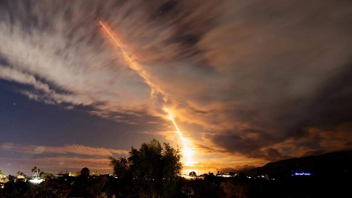 A SpaceX Falcon 9 rocket launches Tuesday night, Jan. 2, 2024, from Vandenberg Space Force Base, as seen from the Goleta foothills.