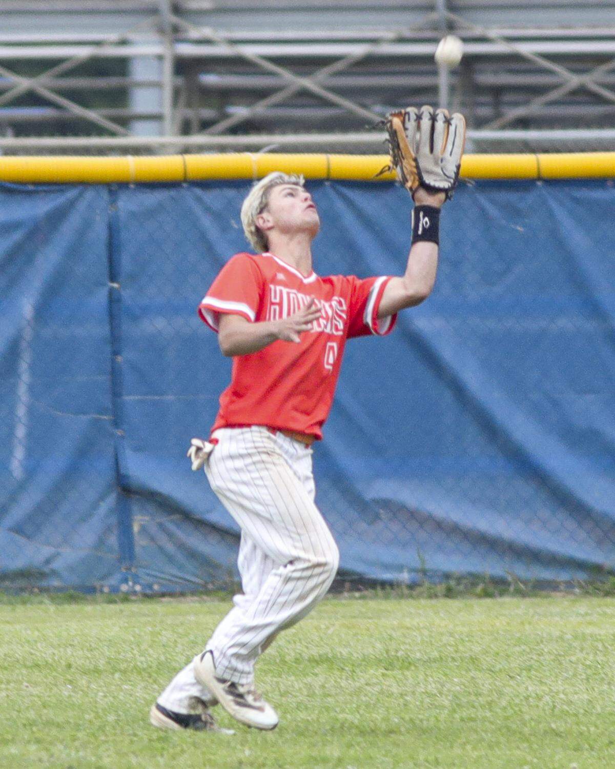 Uly Kaul lost his hat but makes a catch in the outfield. Atascadero won 6-4 in a baseball game against Morro Bay High School May 1, 2025.