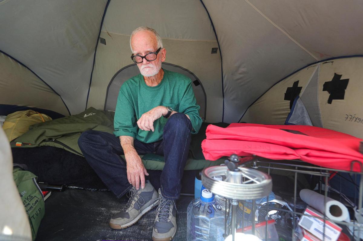 Christopher Dierks, 74, lives in a tent on Palisades Avenue in Los Osos because he does not want to burden his children. San Luis Obispo County recently adopted a no overnight camping ordinance in the North Coast community after dozens of unhoused residents began living on the street. Those staying in their vehicles will have to move to a safe parking site, but tent campers like Dierks may be allowed to stay temporarily.