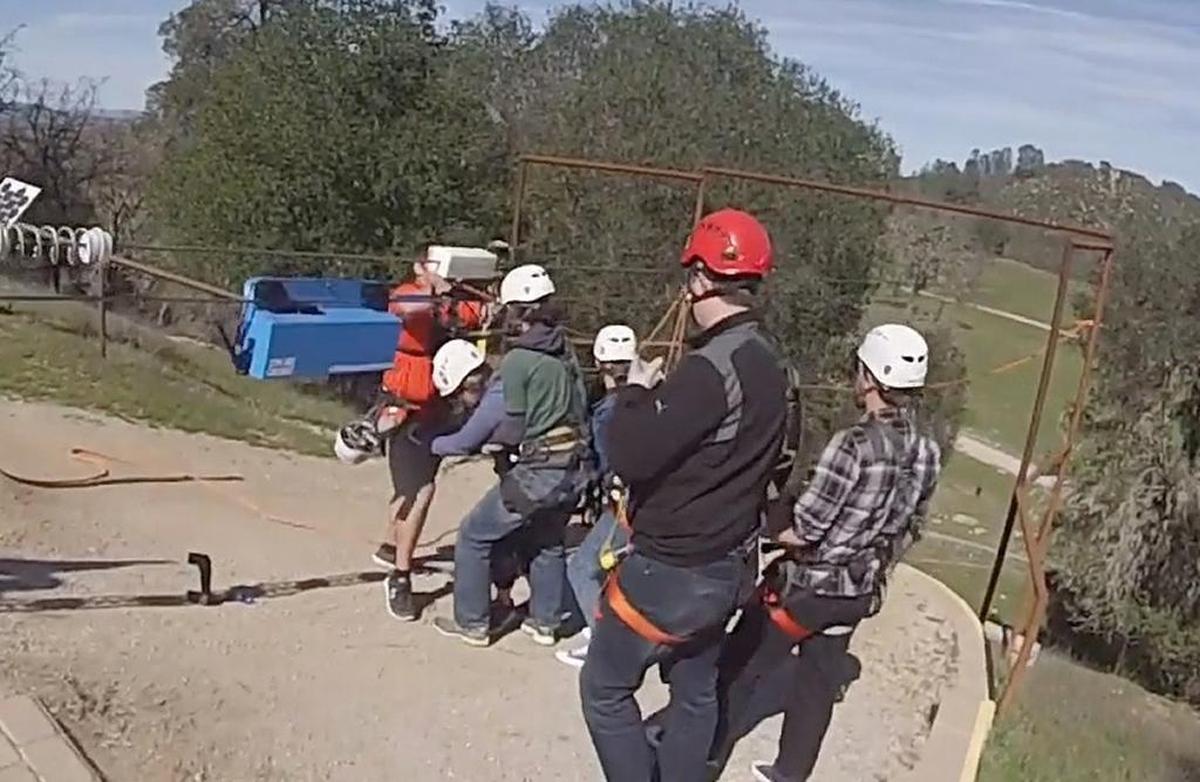 Margarita Adventures employees and friends of Tess Trudgeon help her off a zip line after another rider slammed into Trudgeon as she dangled in the slack of a zip line in February 2016. The San Jose woman left the popular Santa Margarita zip-lining park with fractured ribs, a punctured lung and spinal fractures after the accident, a lawsuit filed Thursday, Sept. 14, 2017, claims.