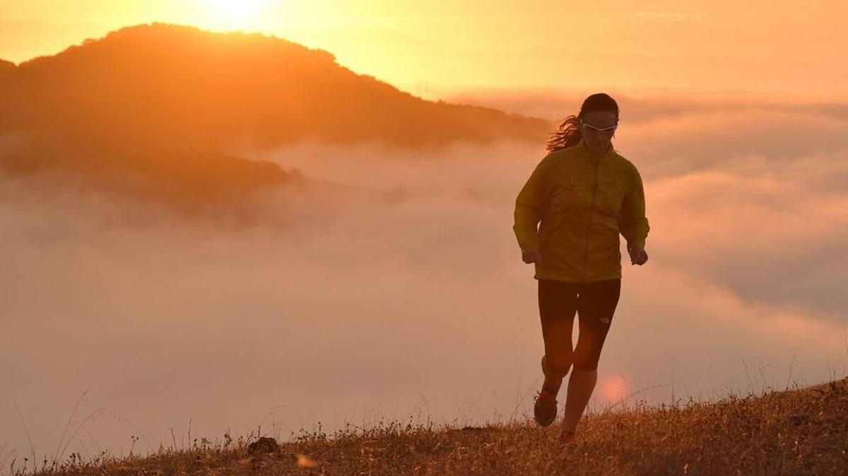 Runner Samantha Pruitt of Race SLO traverses Wild Cherry Canyon, part of 12,000 acres of undeveloped land surrounding Diablo Canyon nuclear power plant near Avila Beach.