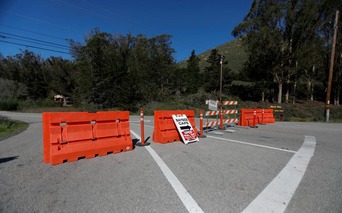 Barricades block access to State Park Road through Morro Bay State Park from South Bay Boulevard. Morro Bay issued citations for violations of road closure measures early in the pandemic.