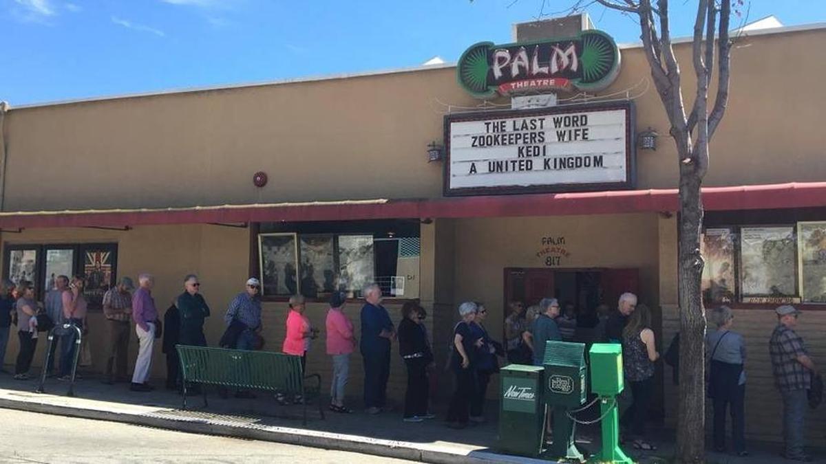 Moviegoers line up outside the Palm Theatre in downtown San Luis Obispo in 2017. The arthouse movie theater is closed due to coronavirus concerns.