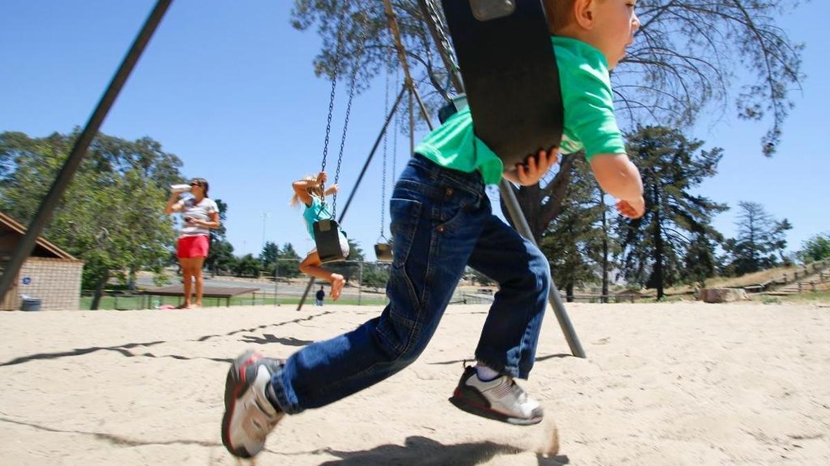 Noah Rubenstein, 5, swings at Nipomo Community Park, which will receive $400,000 for new sport courts or a skate park.