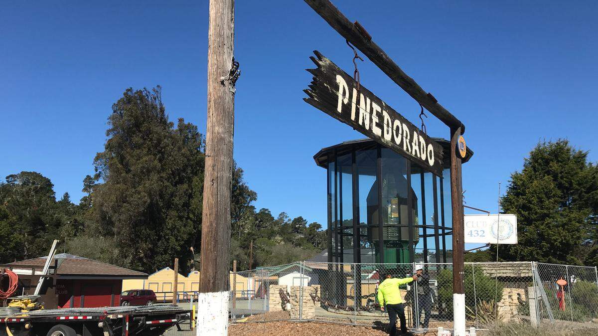 On May 11, 2022, workers from Fence Factory Rentals in Atascadero quickly wrap a protective construction-fence barrier around the circa 1875 Piedras Blancas Light Station First Order Fresnel lens and its glass enclosure.