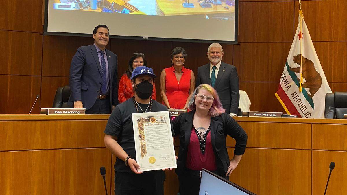 The San Luis Obispo County Supervisors voted 3-1 to pass a resolution supporting Pride Month on July 9, 2024. In the front row, Gala Pride and Diversity Center representatives Mark Sanchez Santos and JBird attended to accept the resolution. Back from left are supervisors Jimmy Paulding, Debbie Arnold, Dawn Ortiz-Legg and Bruce Gibson.