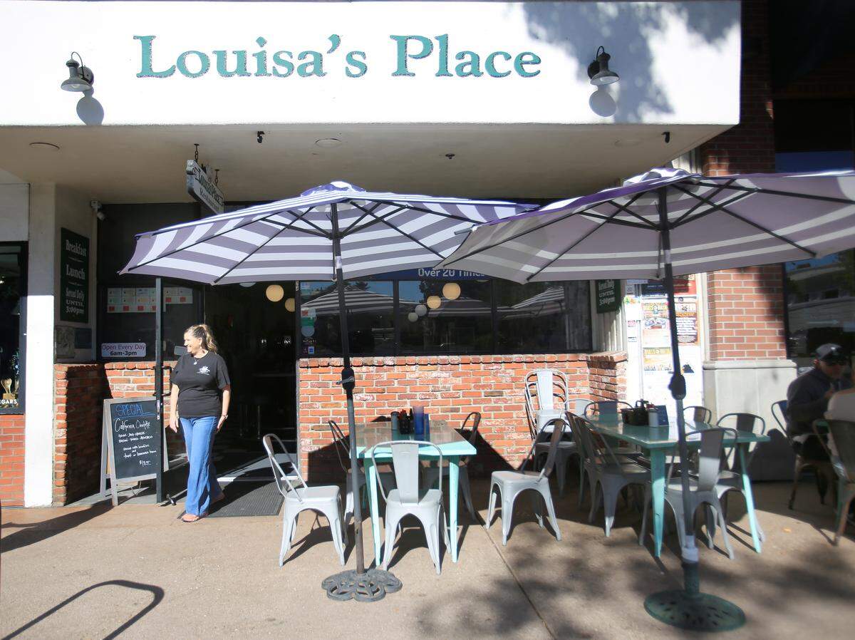 Louisa’s Place owner Audrey Pyle checks outdoor seating after the breakfast-lunch diner closed for the day in late November 2025. The restaurant has been at 964 Higuera St. in downtown San Luis Obispo since the diner opened in 1958.