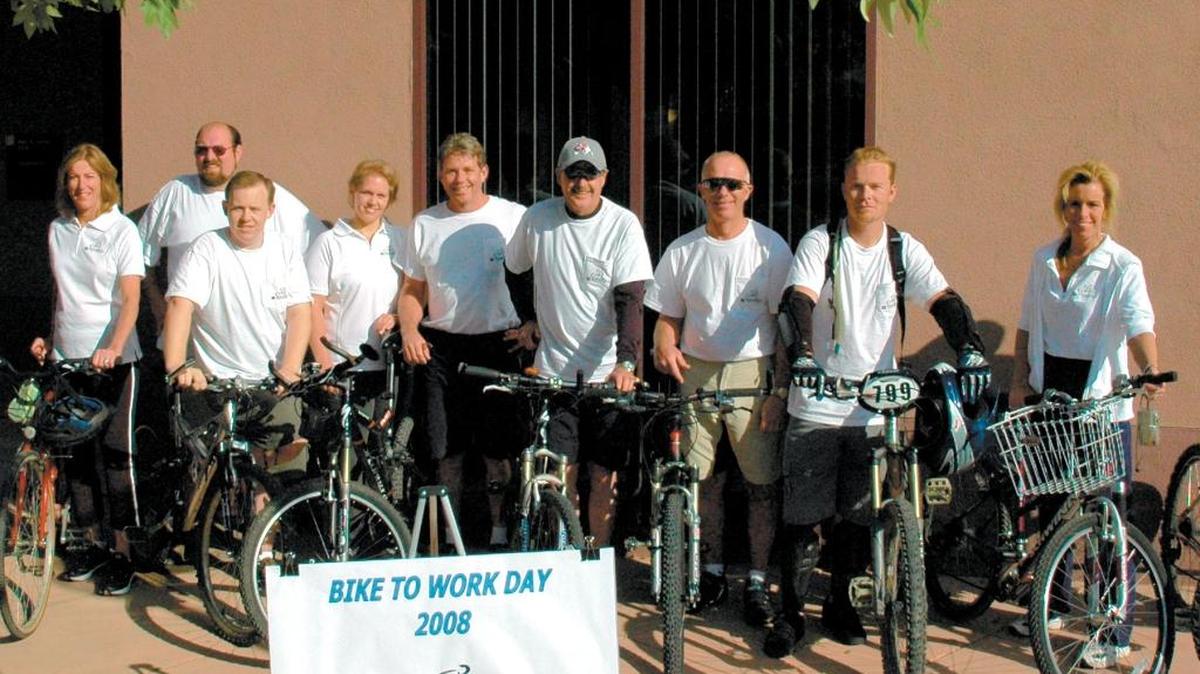 Employees at North Coast Engineering in Paso Robles pose with their bikes as part of Bike to Work Day in 2008.
