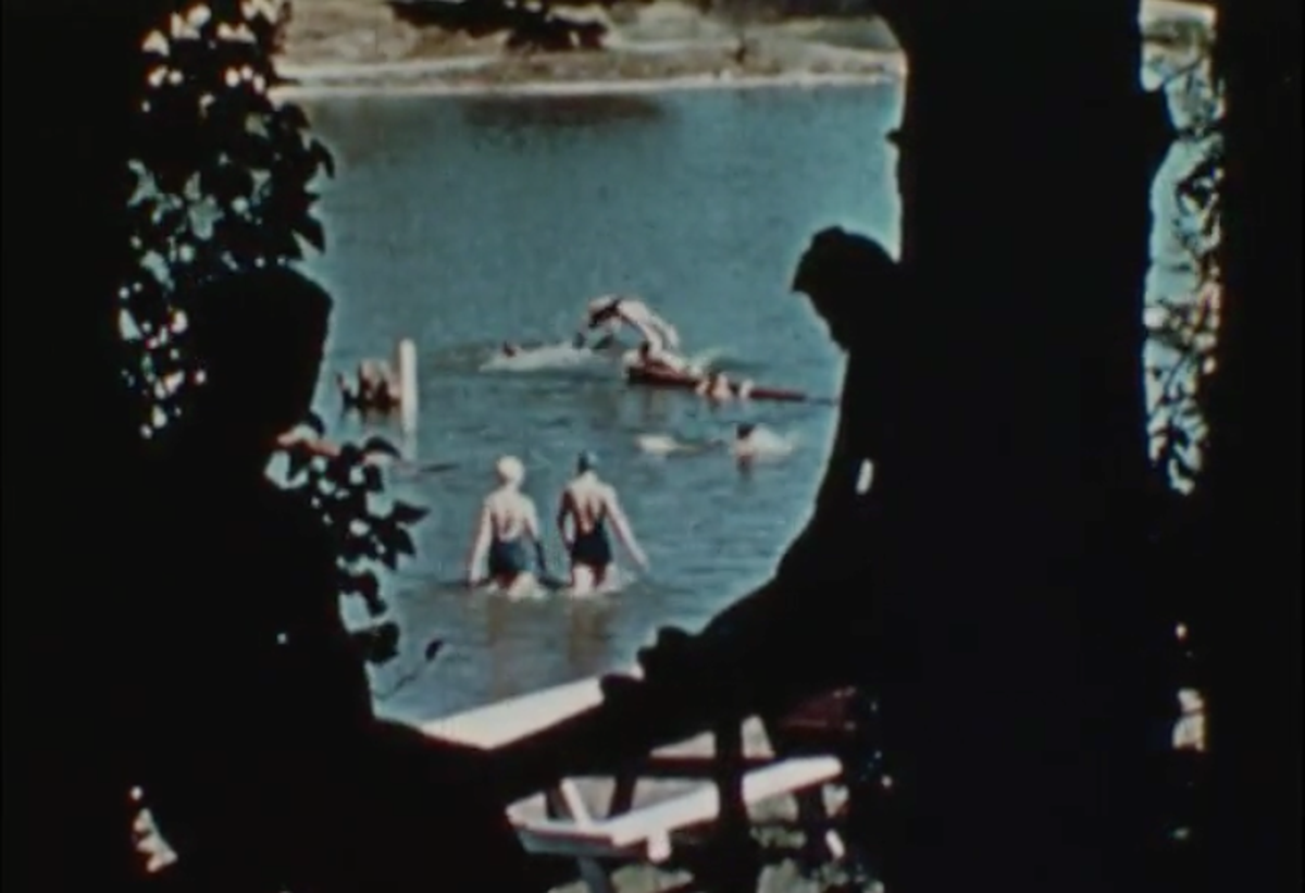 People swim and boat at Atascadero Lake in a screenshot from the 1938 San Luis Obispo Chamber of Commerce film “Recreation Unlimited.”