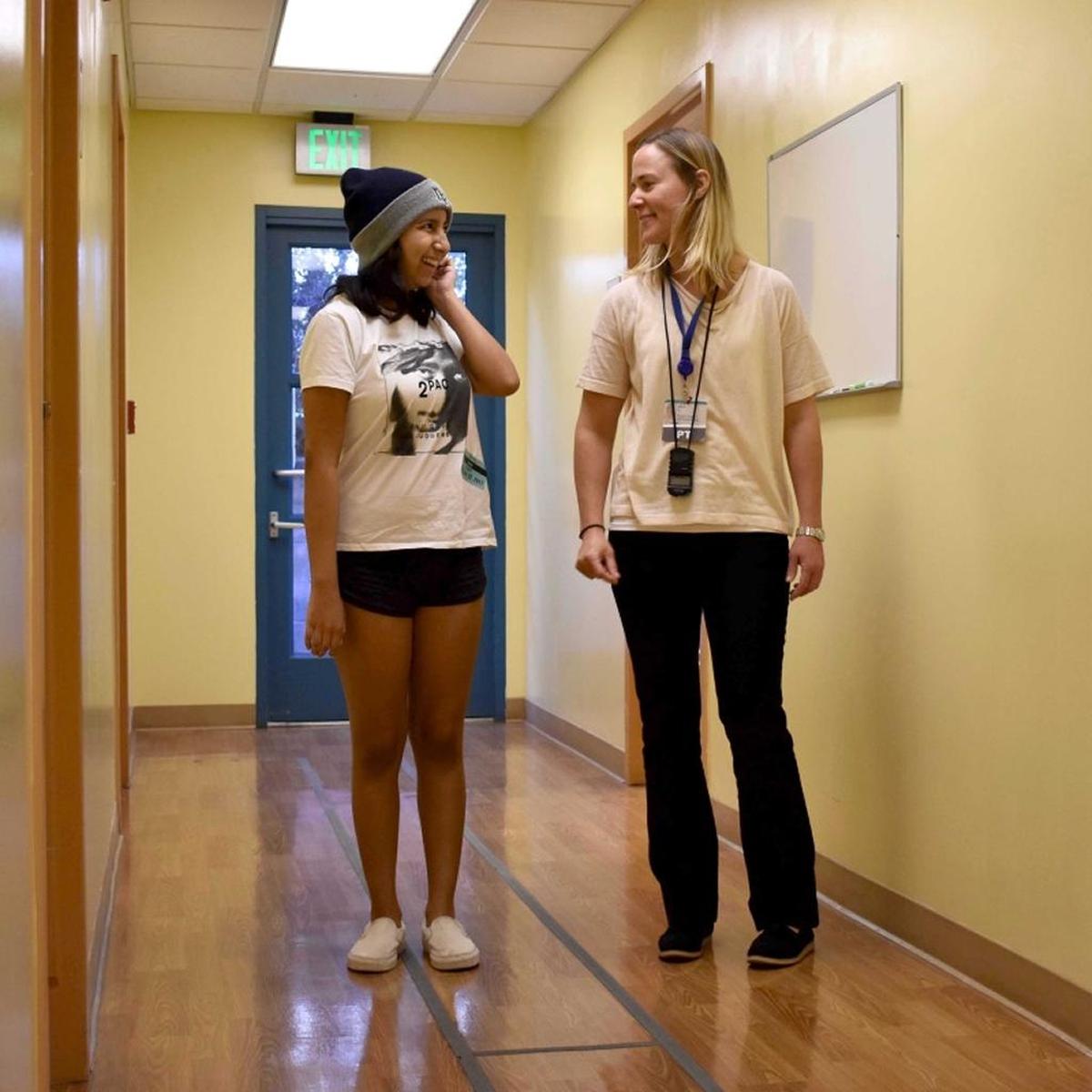 Alyssa Nuño and Jill Trato, a physical therapist at Cottage Rehabilitation Hospital Outpatient Clinic, share a moment before starting a recovery exercise at Santa Barbara Cottage Rehabilitation Hospital. Nuno is recovering from serious injuries suffered in September’s microburst storm at the Santa Barbara waterfront.
