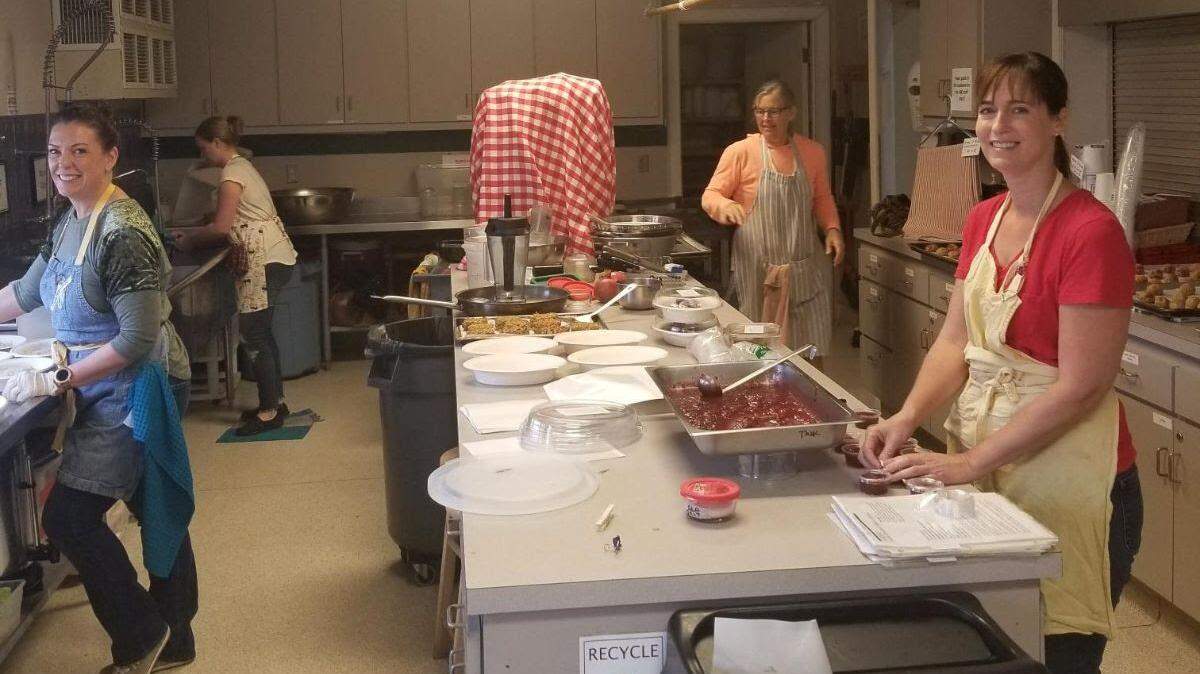 Templeton Wellness Kitchen staff cook in Atascadero Bible Church’s commercial kitchen, which the nonprofit is using temporarily while its space is cleaned up after being damaged in a structure fire.