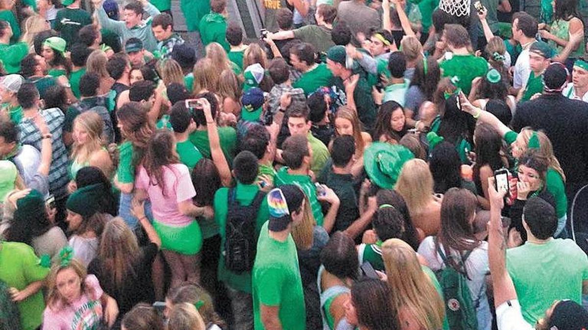 Partiers fall as a garage roof collapses during March 2015 St. Fratty’s Day celebration in San Luis Obispo.