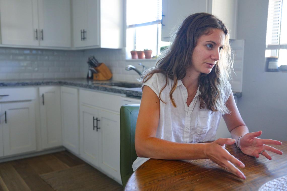Lindsey Altman sits in the kitchen of the home she bought with her husband, Brad, in Atascadero. Brad’s family helped the couple with their down payment.