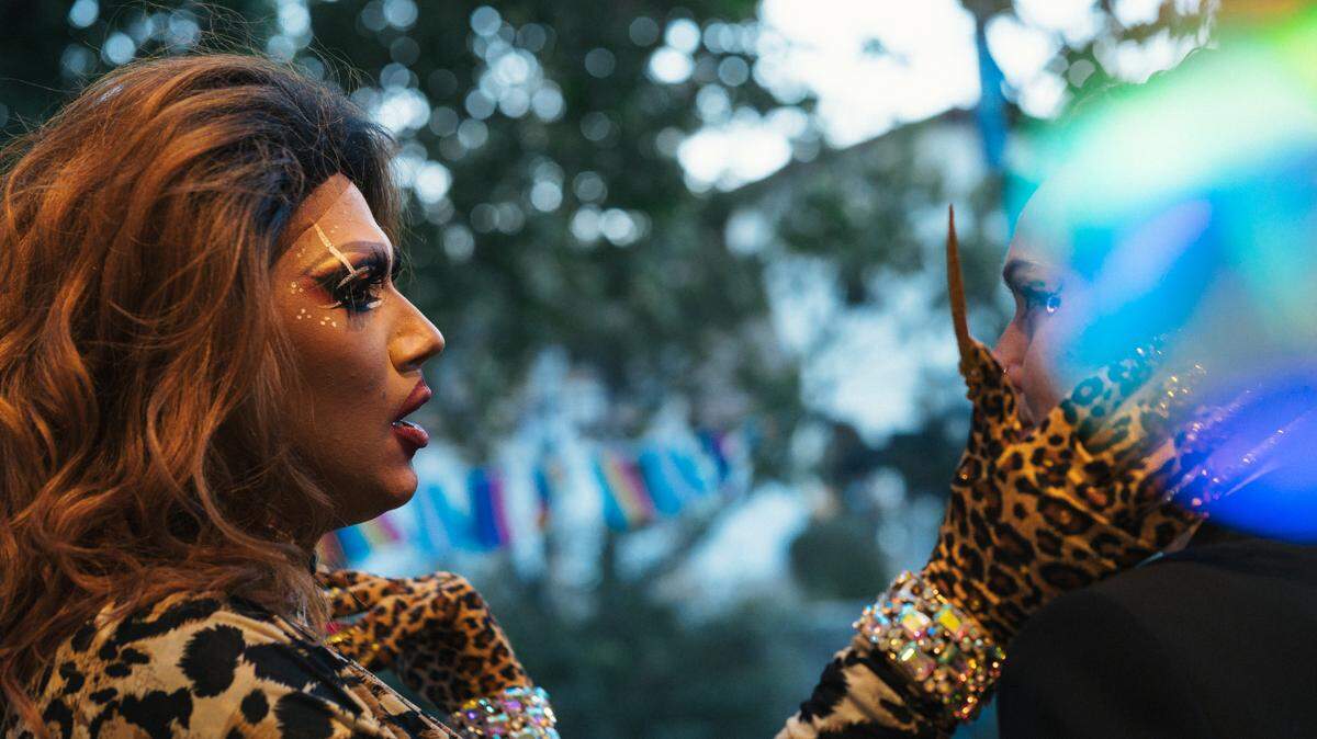 Drag Queen Nala Diamond shares a moment with artist Amanda Garcia while performing at Art and Soul’s Drag Night on Aug. 20, 2022. Garcia was collecting tips for the drag queens during the performance.