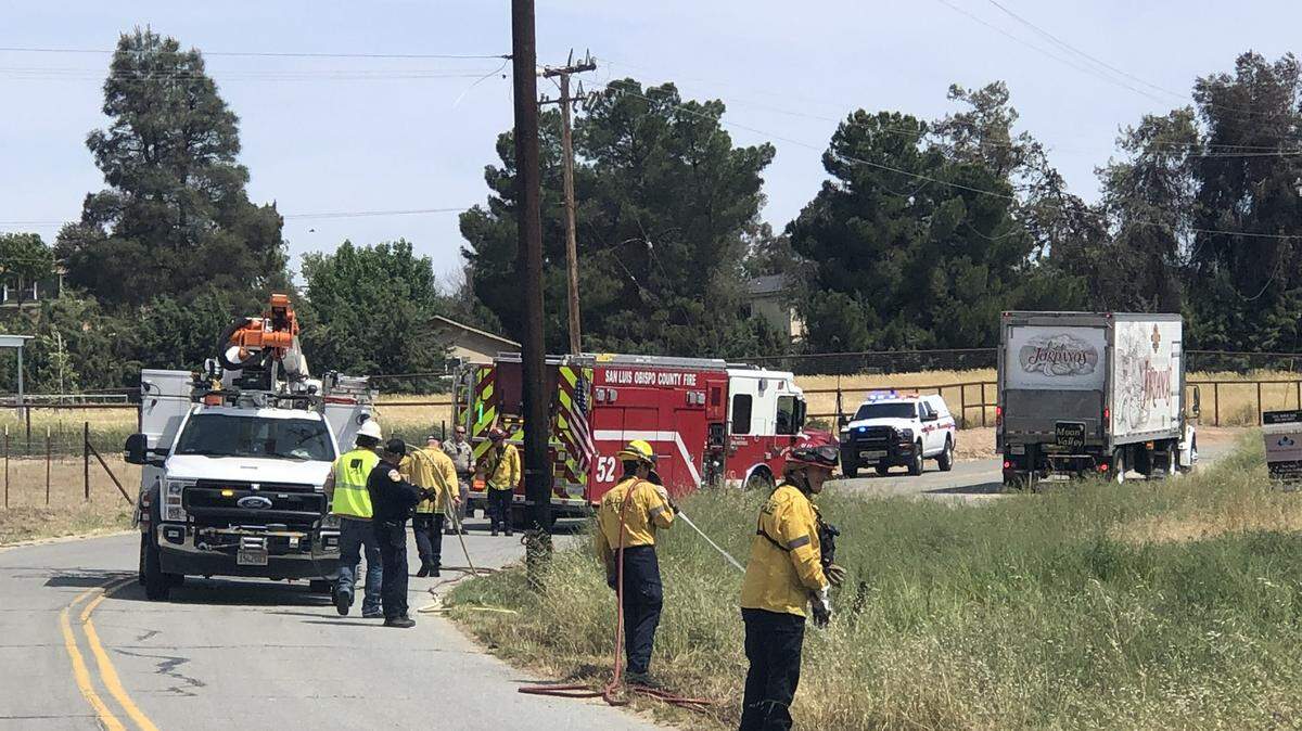 Firefighters worked to extinguish three spot fires below PG&E power lines in Paso Robles on April 30, 2025.