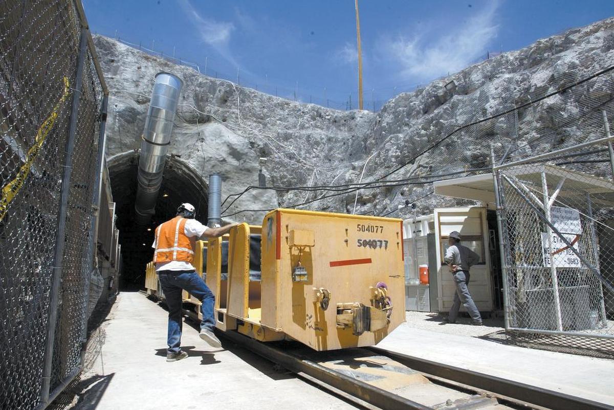 A 2002 photo shows a worker boarding a train car that leads into the Yucca Mountain radioactive waste disposal site, which was to have been a “deep repository” for the nation’s stockpile of spent nuclear fuel.