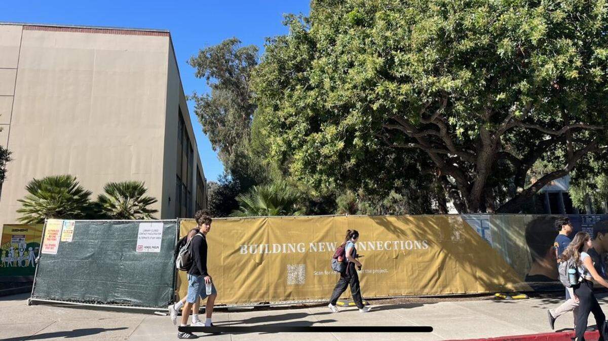Fencing blocks the Kennedy Library at Cal Poly San Luis Obispo, which is closed for renovations until 2025.
