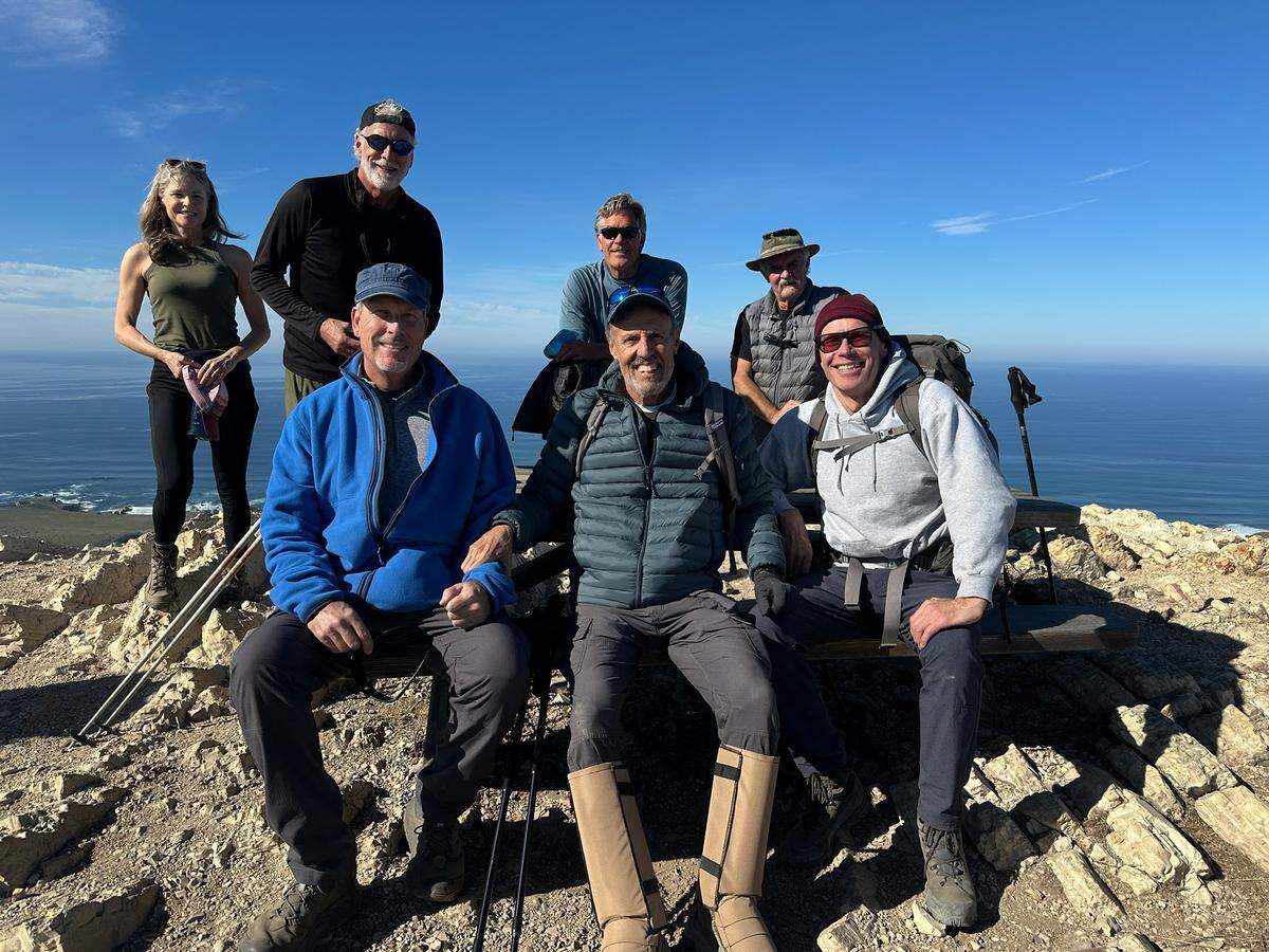 Los Osos resident Bob Kamm, center, hiked to the summit of Valencia Peak at Montaña de Oro State Park for the thousandth time on Jan. 21, 2025, this time with six friends, Alison Dimond, left, Ralph Gorton, Joe Balog, Jeff Schultz, Mike McGill and Cliff Dimond.