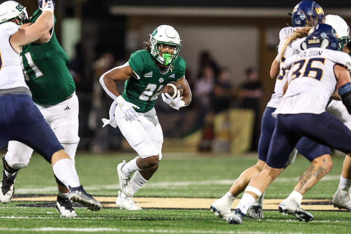 Cal Poly running back Paul Holyfield Jr. (22) finds a hole in the fourth quarter during the Mustangs’ 24-17 over Northern Colorado on Saturday, Oct. 21, 2023, at Mustang Memorial Field.