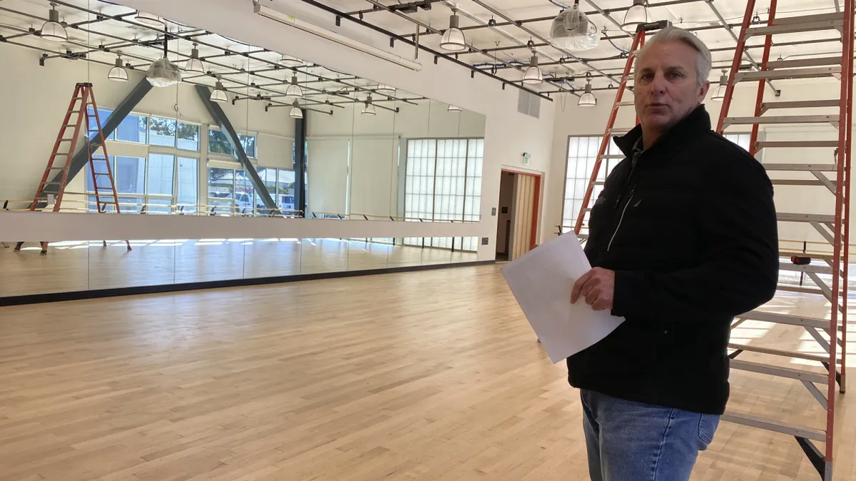 Steven Marshall, facilities director, talks about mirrors and special floors that make up a studio for dancers at the new Fine Arts Complex on Allan Hancock College’s Santa Maria campus.