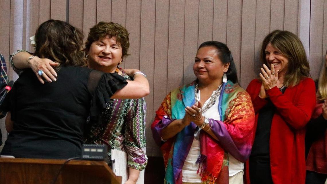 Mayor Heidi Harmon hugs Mona Olivas Tucker, chair of the Northern Chumash Tribe, as Clairibel Terril and Wendy Lucas applaud on Tuesday as the City Council proclaimed San Luis Obispo would celebrate Indigenous Peoples Day in place of Columbus Day.