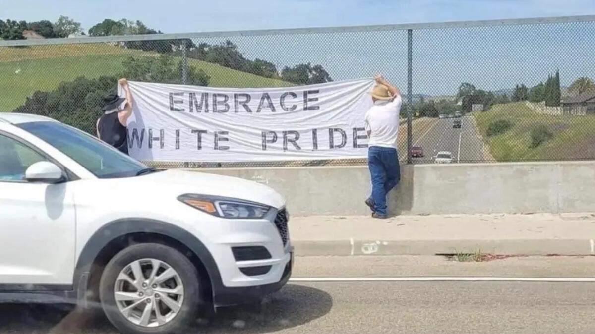 A post on Reddit shows two people holding an “Embrace white pride” banner on the Vineyard Drive overpass in Templeton on Saturday, April 29, 2023. The image was apparently flipped so that the words would read properly. That would place the pair holding the banner on the north side of the overpass, displaying it to southbound traffic. 